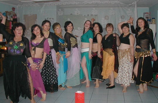 the group poses in their best.  (Compare this photo to the one of the same group of women in April!)
