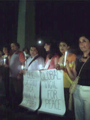 the full moon rises behind the vigilers.