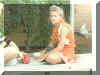 Amy Weldon sitting on a bench outside the cafeteria.