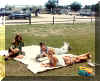Allison "Simpler" Cox, Mark Reynolds & Kim Whitney on OPHS front lawn signing yearbooks.