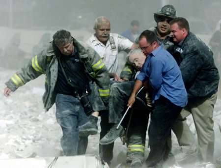New York Fire Dept. Chaplain, body taken to safety...