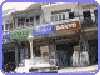 A shop located next to the supermarket