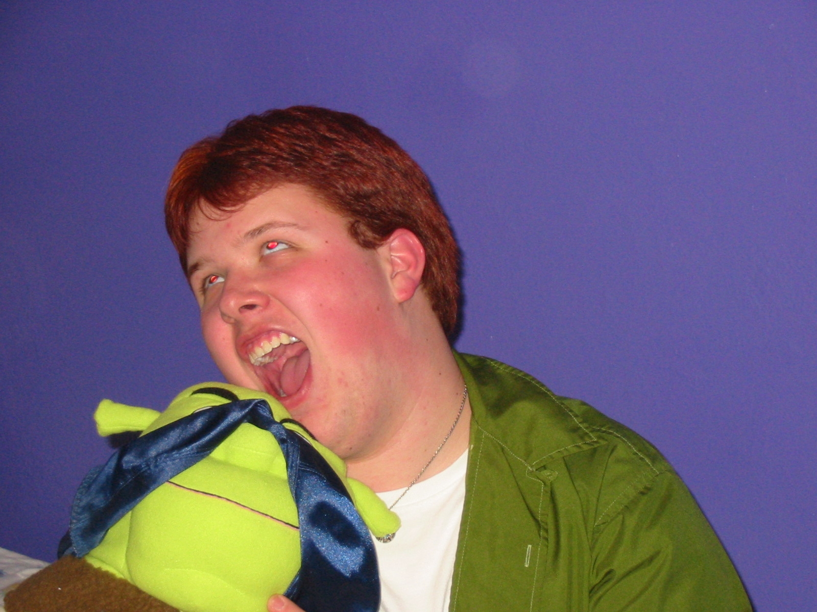 Shrek (with GG's bra on his head) and me get 'physical' at a gang meeting. What it looks like? One crazy look on my face and Shrek hiding under the bra from it! :D
