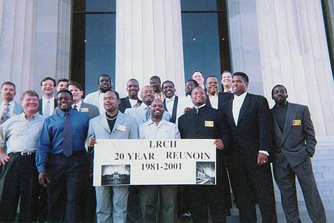 The men pose before the banquet