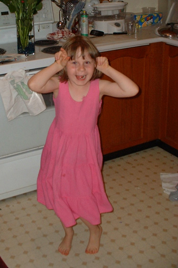 Maddie making Bunny Ears for the camera