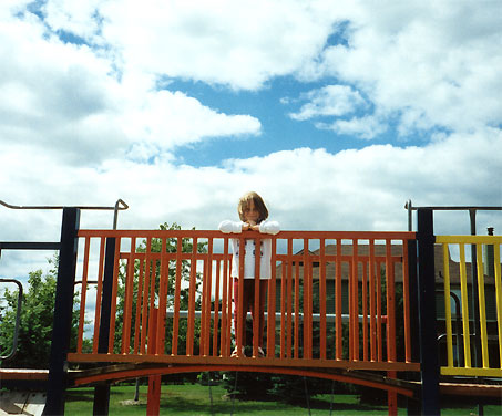 Emma on the bridge of the slide