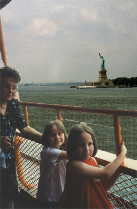 The Statue of Liberty, Emma, Maddie, and Mom