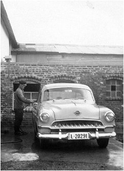 Mandius Golf with his car, purchased in 1957