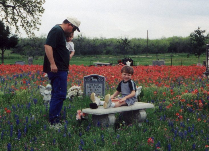 Sarah's daddy and brother Dylan at her graveside 