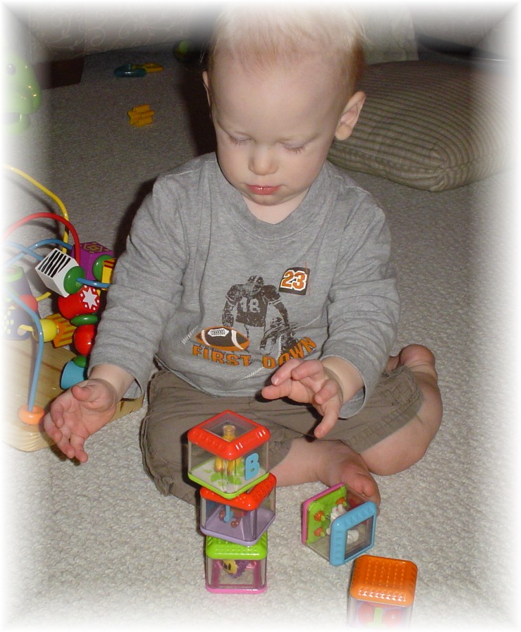 Aidan learning to stack blocks...