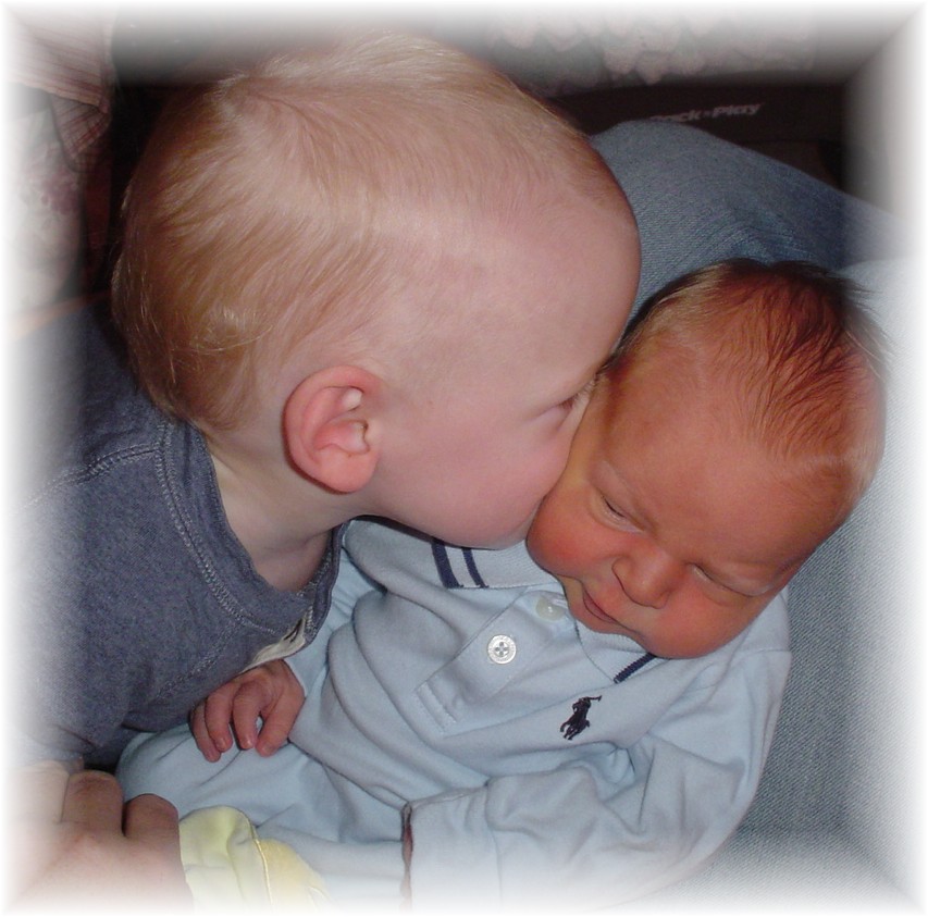 Aidan giving John Paul kisses.