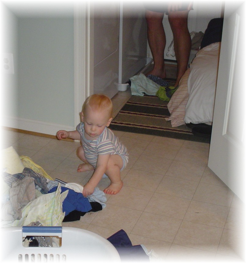 Aidan helping Daddy with laundry