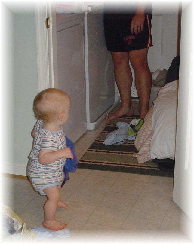 Aidan helping Daddy with laundry