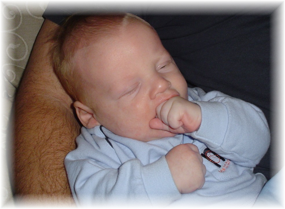 John Paul eating his hand