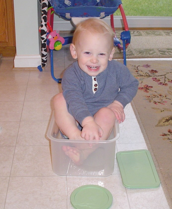 Aidan in the tupperware