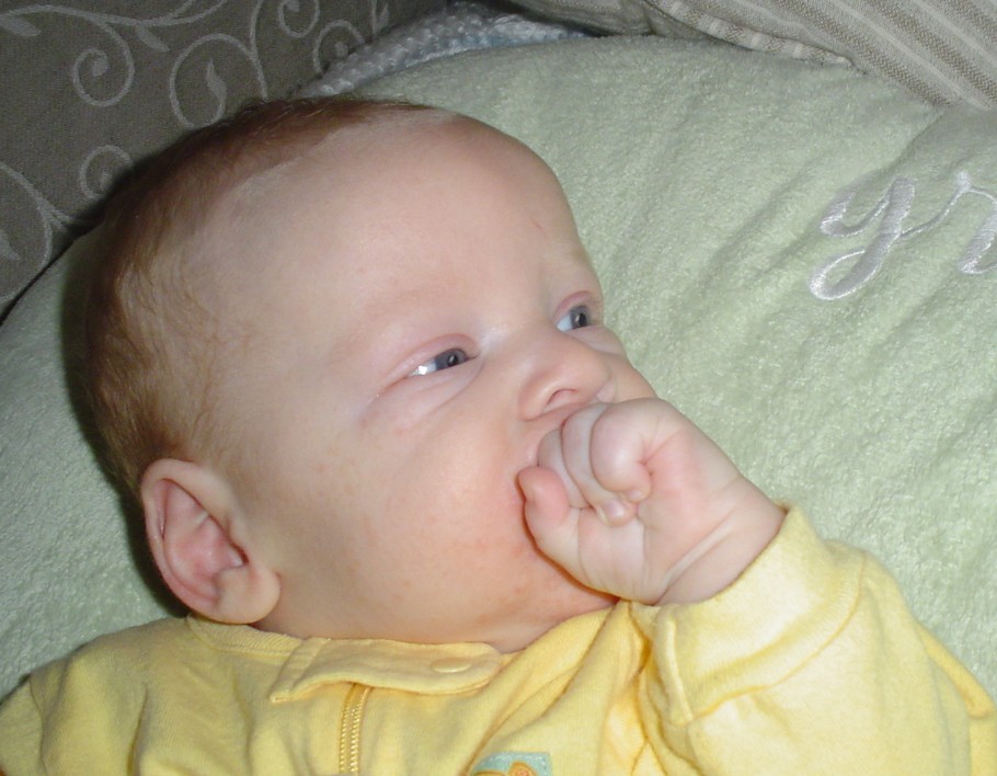 John Paul eating his hand