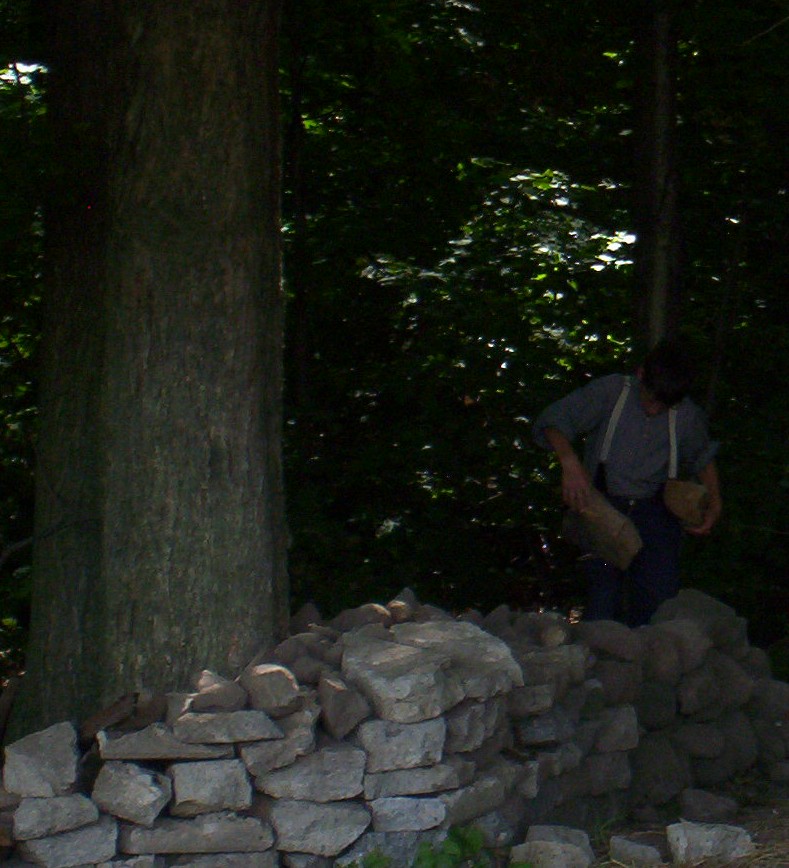Luke gathering firewood for camp