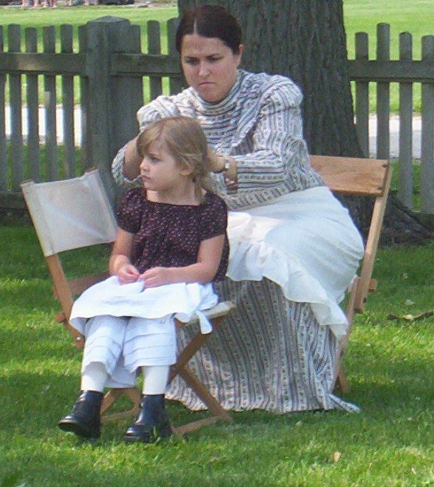 Emma having her hair braided at the Wood County Historical Museum, Bowling Green, OH