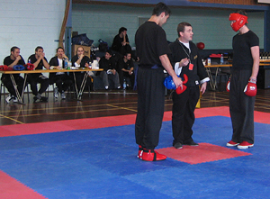 Ollie in red gets the rules from the referee before his final bout.