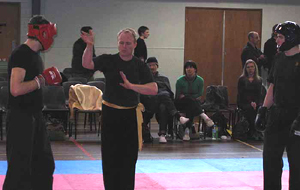Ollie (in red) gets a point from the referee during point sparring compertition.