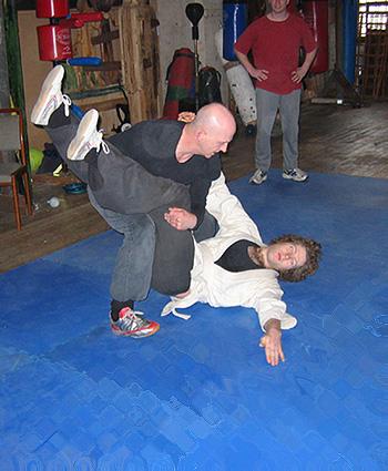 Ollie practising a breakfall with the help of Si Gung.