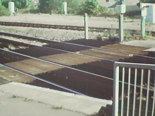 `Board crossing' at east end of station.