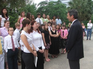 Delegates Jennifer Wilson and Keegan Campbell present a certificate of appreciation to Gov. Sanford . . . 
