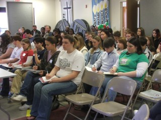 Delegates taking notes and learning . . . 