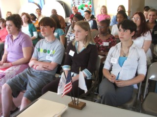 Delegates viewiing a P2P video - Hotel Behavior and Home Stay & Goodwill Gifts