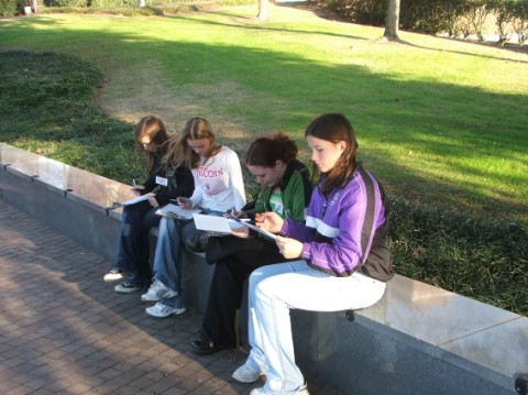 Delegates reviewing the teams' answers with the specific answer key . . . 