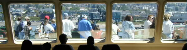 Folks riding a ferry into town.