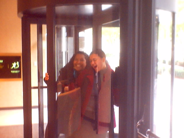 Nina and I in the revolving door of her building, downtown ATL, I'd never been in a revolving door before and stepped in with her, nearly killing the both of us!