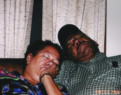 Mom and Dad asleep on the couch