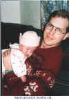 baby Sarah sleeping on me subtitled.jpg (68413 bytes)