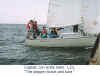 me at the helm close up subtitled.jpg (54059 bytes)