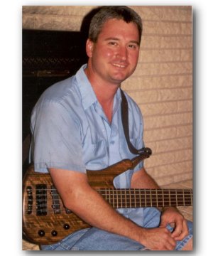 Mark plays a 5-string Warwick