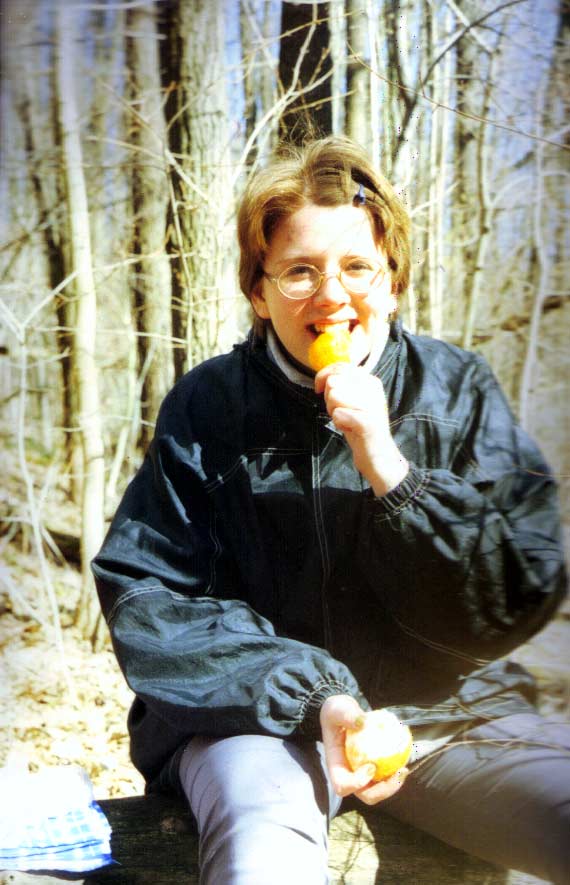 Katya is eating an orange
