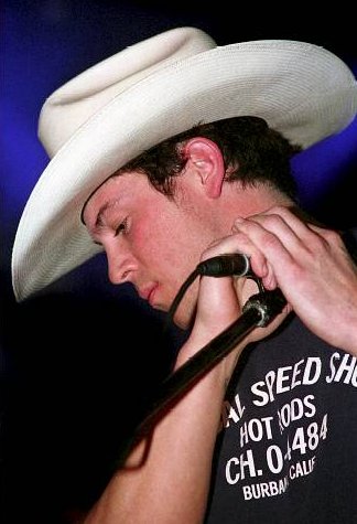 Christian Kane doing his thang on stage as the lead singer of Kane
