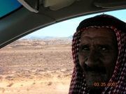 Soon after leaving Aqaba I pick up a hitch-hiker at one of the military checkpoints along this lonely road. Unable to communicate he sits silently beside me staring straight ahead - occasionally looking over with a puzzled look when I slow down or stop to take yet another photo of the beautiful desert landscapes before us.