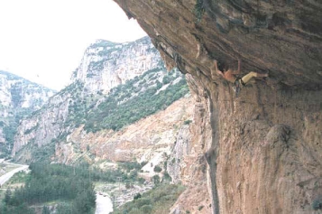 Trying project "PigMaster" (8b+) in Kleisoura; photo by Miltos Zervas