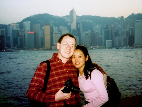 Barry and Chen Pretsell, with the Hong Kong harbour behind