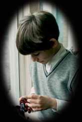 Boy enchanted by a plant