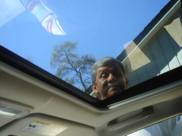 It has a moon roof! *sigh* (That's my dad BTW)