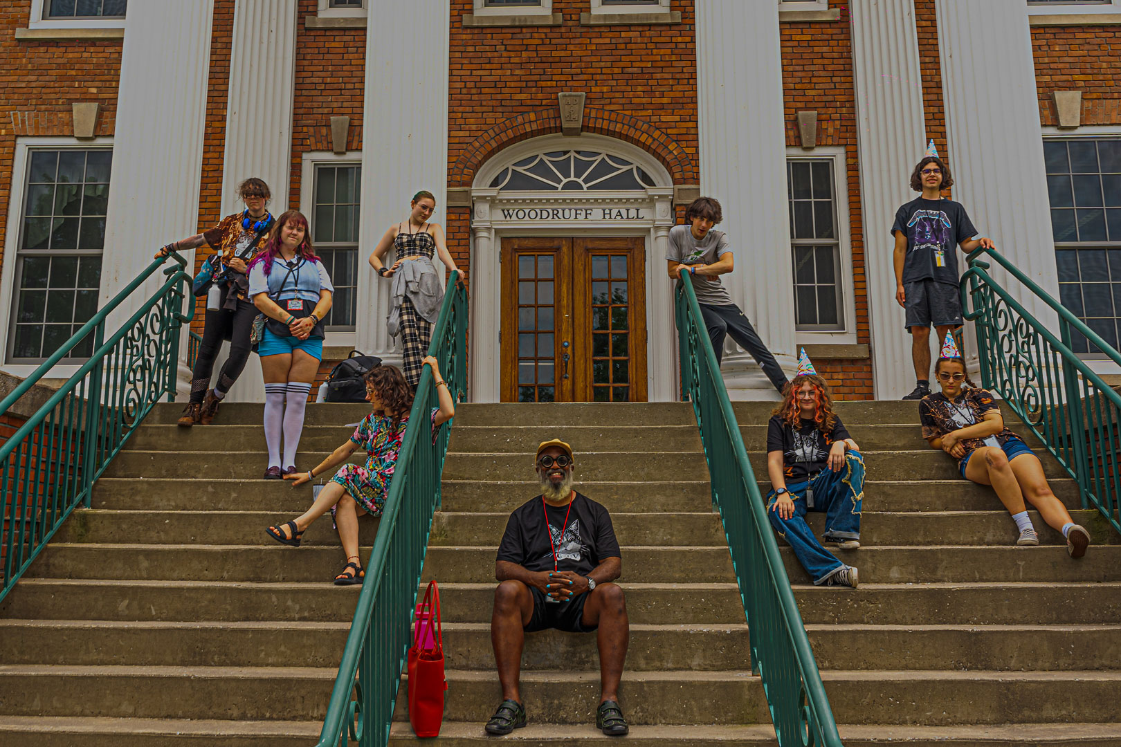 poetry speaking class posing for a photo on the library steps