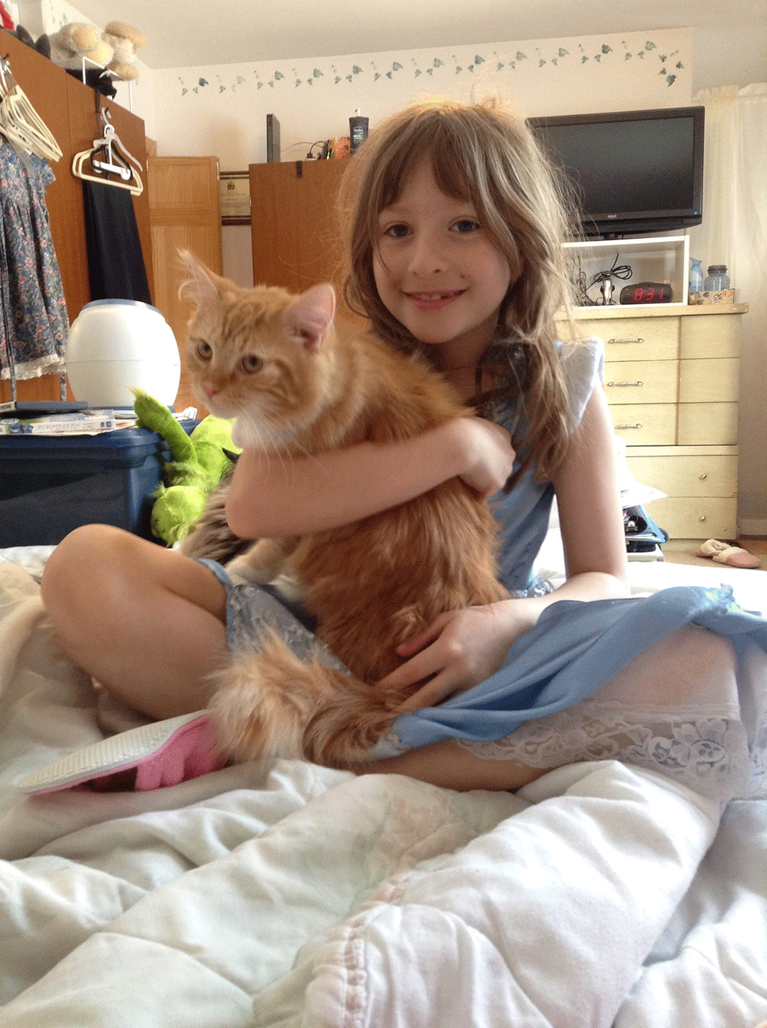 nine year old phoenix holding there cat