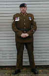 Simon with his fathers war medals