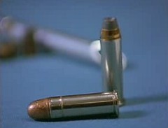 One bullet with round head and one hollow point bullet