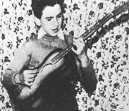 George with his first guitar, 1956
