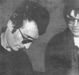 Twisted: Mark Chapman grins as he gets Lennon's autograph