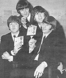 Honoured: the Beatles proudly display their MBEs after meeting the Queen